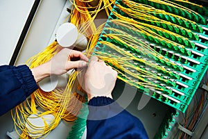 Internet connection. engineer connecting fiber optic cables