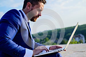 Internet marketing manager works blue sky background. Increase rates online sales tips. Businessman surfing internet or