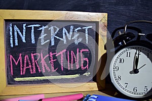 Internet marketing on phrase colorful handwritten on blackboard.