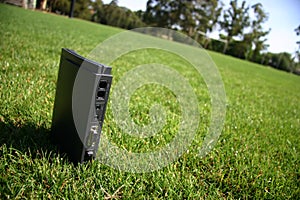 Internet modem on green grass