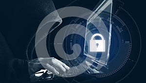 Internet network security system. Hacker in black hoodie using computer laptop
