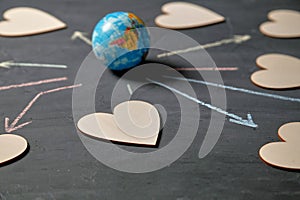 Internet or online dating and love. Global communication, networking and sharing concept. Globe and figures of hearts