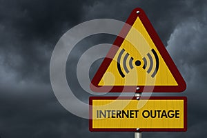 Internet Outage message on warning road sign with stormy sky photo