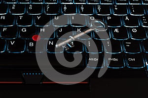 Internet privacy, web security,metallic key on a black computer laptop keyboard