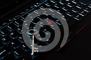 Internet privacy, web security,metallic key on a black computer laptop keyboard