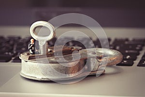 Internet security concept-miniature businessman stand