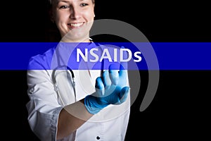 Internet and technology concept. smiling female doctor presses a finger on a virtual screen. NSAIDs written on a virtual