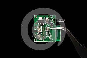 Internet of Things IoT system on a chip SOC integrated circuit computer with small microchip microcontroller isolated on black