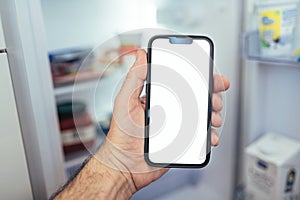 Internet of things smartphone mockup, smart mobile phone with blank screen in front of refrigerator