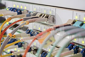 Internet wires are connected to the central router interfaces. There are many optical patchcards in the data center server room.