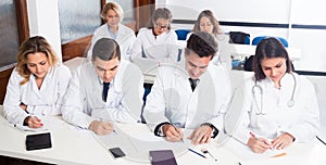 Interns at lecture at university