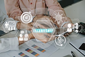 Business team working on digital tablet and financial data with internship icon on virtual screen