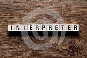 Interpreter - word concept on building blocks, text