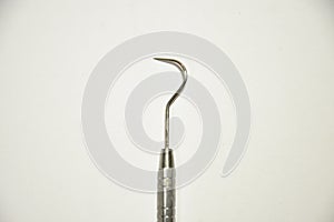 Interproximal probe or Shephard's hook used in dentistry .