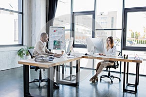 interracial business people in glasses looking