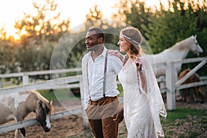 Interracial couple newlyweds at the ranch.