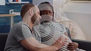 Interracial couple with pregnancy at home