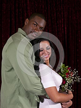 Interracial couple with roses