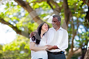 Interracial couple in summer park