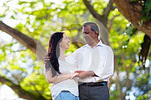 Interracial couple in summer park