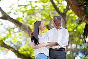 Interracial couple in summer park