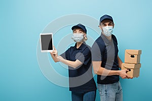 interracial couriers in medical masks, with