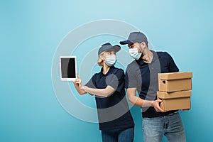 interracial couriers in medical masks, with