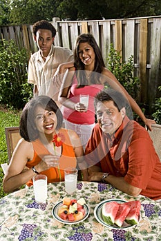 Interracial family in backyard photo