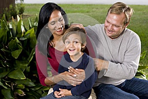 Interracial family with cute five year old boy