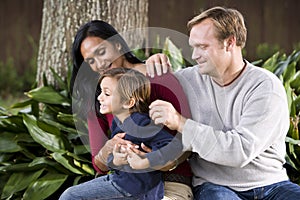 Interracial family with cute five year old boy photo