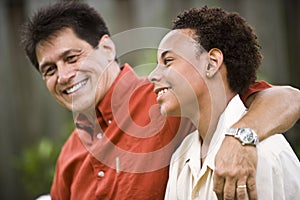 Interracial father and teenage son photo
