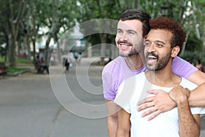 Interracial gay couple outdoor close up