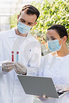 interracial quality inspectors in medical masks