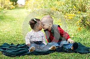 Interracial toddlers showing affection. Fight racism