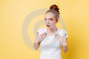 Interrogative ginger woman in t-shirt