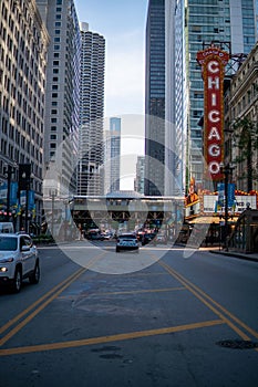 an intersection at the chicago downtown train station, with traffic and tall buildings in the