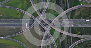 Intersection highway junction crossroad overview top down aerial. Infrastructure road and motor way driving busy street