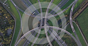 Intersection highway junction crossroad overview top down aerial. Infrastructure road and motor way driving busy street