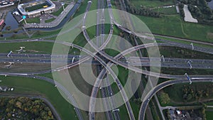 Intersection highway junction crossroad overview top down aerial. Infrastructure road and motor way driving busy street