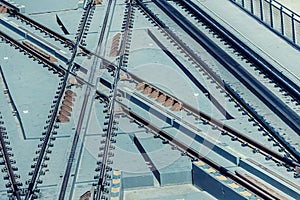 intersection of railway tracks and rails of a train or city rapid tram or metro, aerial view. Transportation and logistics