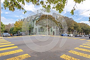 Intersection road with yellow pedestrian lanes in the suburbs of San Francisco, California