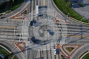 Intersection seen from above with cars and truck in their lanes.