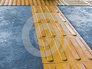 Intersection of Tactile Paving on Ground Surface as Guidance or Warning Sign To Help Visually Impaired or Blind Pedestrians. photo