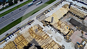 Interstate 35 highway and large apartment complex under construction, Dallas, Texas, Slab foundation, precast concrete