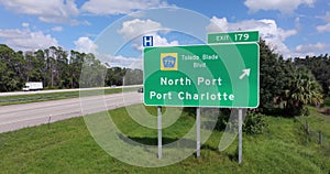Interstate freeway exit sign in Florida, USA. I-75 highway interchange with direction to North Port and Port Charlotte