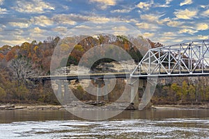 Interstate 70 Highway Truss Bridge Over the Missouri River with Bluffs and Colorful Fall Autumn Leaves photo