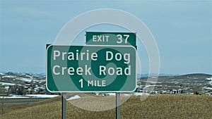 An interstate sign for prairie dog creek road in Wyoming.