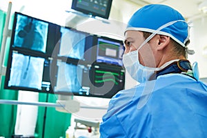 Interventional cardiology. Male surgeon doctor at operation