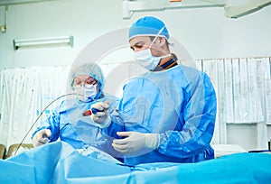 Interventional cardiology. Male surgeon doctor at operation