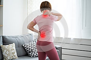 Intervertebral hernia, neck and lumbar pain, woman suffering from backache at home, spinal disc disease